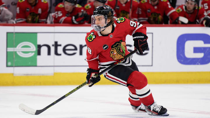 Apr 14, 2024; Chicago, Illinois, USA;  Chicago Blackhawks forward Connor Bedard (98) skates against the Carolina Hurricanes at United Center. Mandatory Credit: Jamie Sabau-USA TODAY Sports