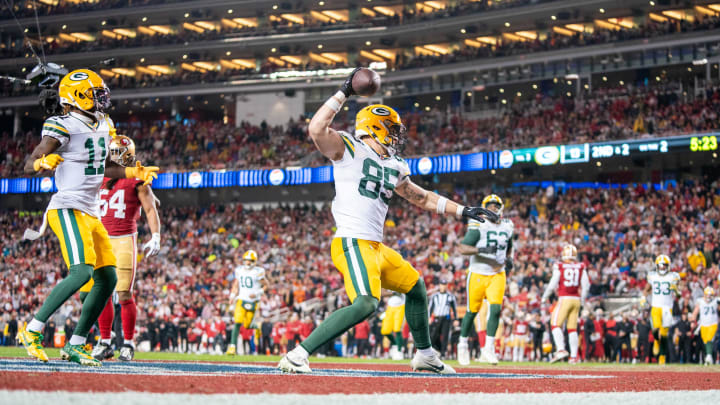 Green Bay Packers tight end Tucker Kraft (85) celebrates after scoring a touchdown against the San Francisco 49ers during the third quarter of their playoff game at Levi's Stadium. 