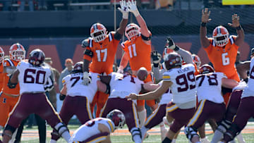 Nov 2, 2024; Champaign, Illinois, USA;  Illinois Fighting Illini linebacker Gabe Jacas (17) and Illinois Fighting Illini defensive lineman Alex Bray (11) attempt to block Minnesota Golden Gophers kicker Dragan Kesich (99) field goal during the first half at Memorial Stadium. Mandatory Credit: Ron Johnson-Imagn Images