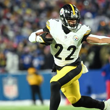 Jan 15, 2024; Orchard Park, New York, USA; Pittsburgh Steelers running back Najee Harris (22) runs the ball in the first half against the Buffalo Bills in a 2024 AFC wild card game at Highmark Stadium. Mandatory Credit: Mark Konezny-USA TODAY Sports