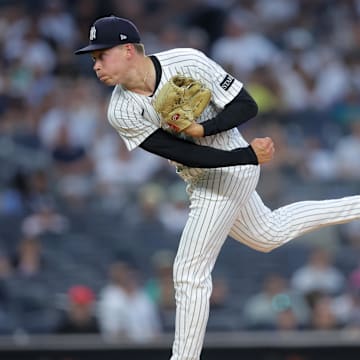 Jul 8, 2025; Bronx, New York, USA; New York Yankees starting pitcher Will Warren (98) follows through on a pitch against the Seattle Mariners during the first inning at Yankee Stadium. Mandatory Credit: Brad Penner-Imagn Images
