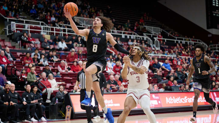 Jan 20, 2024; Stanford, California, USA; Washington Huskies guard Nate Calmese (8) shoots the ball against Stanford Cardinal guard Kanaan Carlyle (3) during the second half at Maples Pavilion. Mandatory Credit: Robert Edwards-USA TODAY Sports