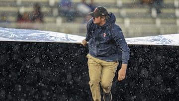 May 19, 2025; Minneapolis, Minnesota, USA; Minnesota Twins grounds crew roll out the on field tarp during the second inning in a game between the Cleveland Guardians and Minnesota Twins at Target Field. Mandatory Credit: Jesse Johnson-Imagn Images