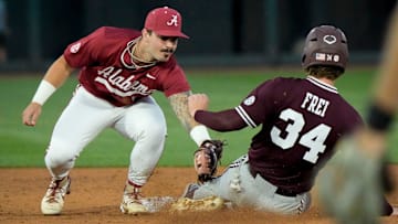 Alabama second baseman Brennen Norton (21) tags out Mississippi State base runner Gehrig Frei at Sewell-Thomas Stadium in Tuscaloosa Friday, April 11, 2025.