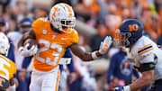 Hokies wide receiver Cameron Seldon (23) puts his hand up to stop UTEP defensive lineman Hunter Rapolla (10) during an NCAA football game between Tennessee and UTEP in Neyland Stadium on Saturday, November 23, 2024.