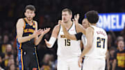 Oklahoma City Thunder forward Chet Holmgren and Denver Nuggets center Nikola Jokic react to a play in the 2025 NBA Playoffs