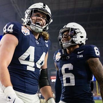 Dec 31, 2024; Glendale, AZ, USA; Penn State Nittany Lions tight end Tyler Warren (44) celebrates with wide receiver Harrison Wallace III (6) after scoring a touchdown against the Boise State Broncos in the Fiesta Bowl at State Farm Stadium. Mandatory Credit: Mark J. Rebilas-Imagn Images