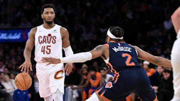 Oct 28, 2024; New York, New York, USA; Cleveland Cavaliers guard Donovan Mitchell (45) sets the play as New York Knicks guard Miles McBride (2) defends during the second half at Madison Square Garden. Mandatory Credit: John Jones-Imagn Images