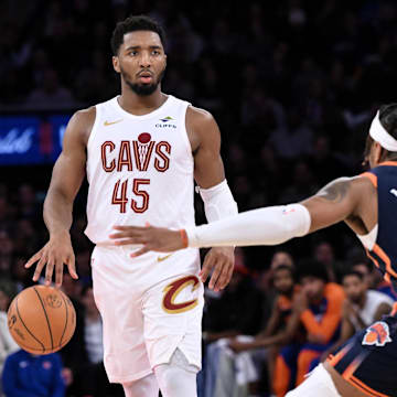 Oct 28, 2024; New York, New York, USA; Cleveland Cavaliers guard Donovan Mitchell (45) sets the play as New York Knicks guard Miles McBride (2) defends during the second half at Madison Square Garden. Mandatory Credit: John Jones-Imagn Images
