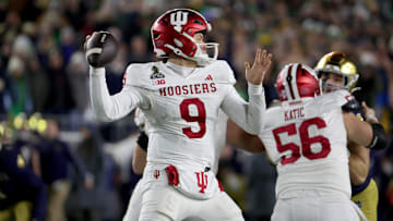 Dec 20, 2024; Notre Dame, Indiana, USA; Indiana Hoosiers quarterback Kurtis Rourke (9) throws during the second half against the Notre Dame Fighting Irish at Notre Dame Stadium. Mandatory Credit: Trevor Ruszkowski-Imagn Images
