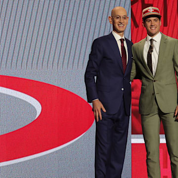 Reed Sheppard poses for photos with NBA commissioner Adam Silver after being selected in the first round.