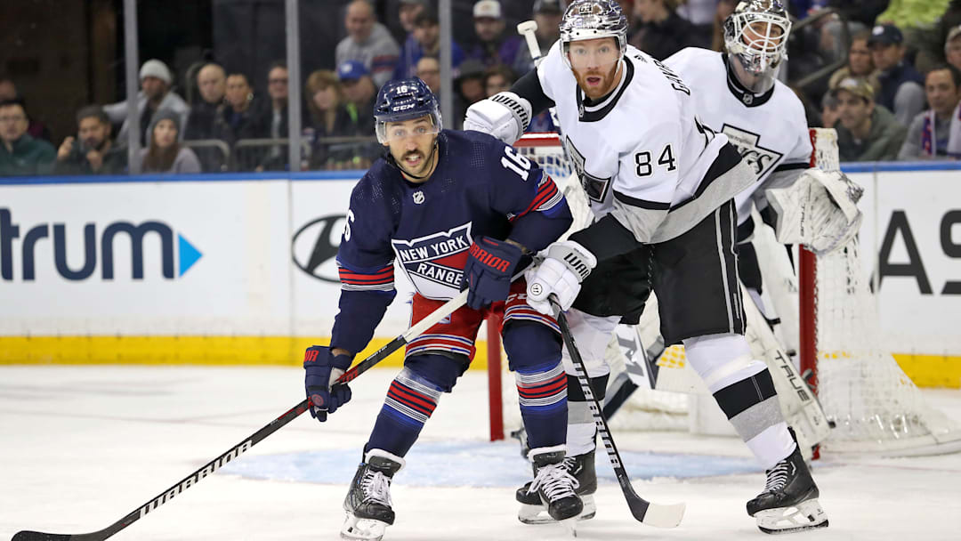 Dec 10, 2023; New York, New York, USA; New York Rangers center Vincent Trocheck (16) and Los Angeles Kings defenseman Vladislav Gavrikov (84) battle for position in front of Los Angeles Kings goalie Pheonix Copley (29) during the first period at Madison Square Garden. Mandatory Credit: Danny Wild-Imagn Images