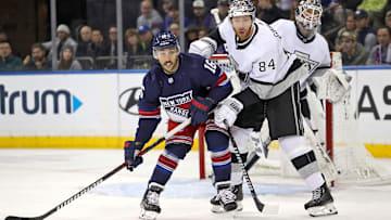 Dec 10, 2023; New York, New York, USA; New York Rangers center Vincent Trocheck (16) and Los Angeles Kings defenseman Vladislav Gavrikov (84) battle for position in front of Los Angeles Kings goalie Pheonix Copley (29) during the first period at Madison Square Garden. Mandatory Credit: Danny Wild-Imagn Images