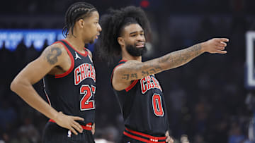 Mar 31, 2025; Oklahoma City, Oklahoma, USA; Chicago Bulls guard Coby White (0) talks to forward Dalen Terry (25) during the first quarter against the Oklahoma City Thunder at Paycom Center. Mandatory Credit: Alonzo Adams-Imagn Images