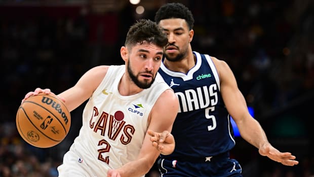 Cleveland Cavaliers guard Ty Jerome drives to the basket against Dallas Mavericks guard Quentin Grimes