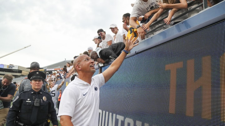 Penn State coach James Franklin celebrates with fans after the Nittany Lions defeated the West Virginia Mountaineers at Mountaineer Field. 