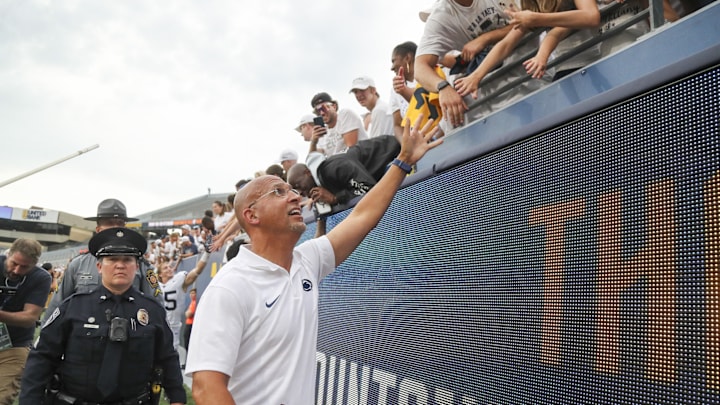 Penn State coach James Franklin celebrates with fans after his team defeated the West Virginia Mountaineers. 