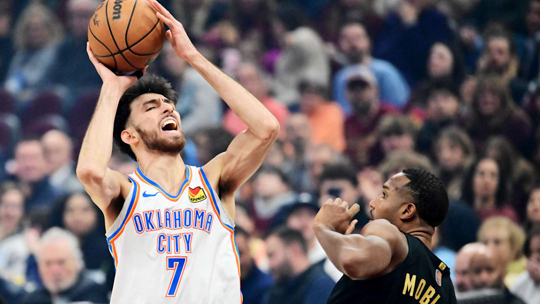 Jan 19, 2026; Cleveland, Ohio, USA; Oklahoma City Thunder center Chet Holmgren (7) drives to the basket against Cleveland Cavaliers center Evan Mobley (4) during the first quarter at Rocket Arena. Mandatory Credit: Ken Blaze-Imagn Images