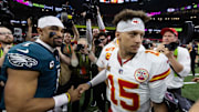 Feb 9, 2025; New Orleans, LA, USA; Philadelphia Eagles quarterback Jalen Hurts (1) greets Kansas City Chiefs quarterback Patrick Mahomes (15) following Super Bowl LIX at Ceasars Superdome. Mandatory Credit: Mark J. Rebilas-Imagn Images