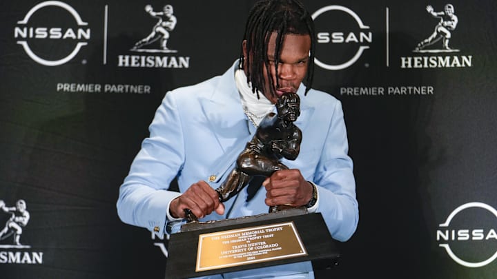 Colorado Buffaloes wide receiver/cornerback Travis Hunter poses for a photo after winning the Heisman Trophy award during the 2024 Heisman Trophy Presentation.