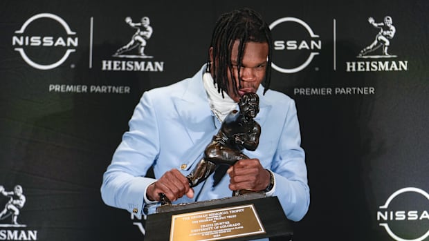 Colorado Buffaloes wide receiver/cornerback Travis Hunter poses for a photo after winning the Heisman Trophy award.