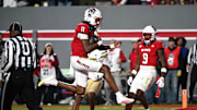 Nov 1, 2025; Raleigh, North Carolina, USA;  North Carolina State Wolfpack quarter back CJ Bailey (11) scores a touchdown against the Georgia Tech Yellow Jackets during the first quarter at Carter-Finley Stadium. Mandatory Credit: Zachary Taft-Imagn Images
