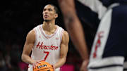 Mar 15, 2025; Kansas City, MO, USA; Houston Cougars guard Milos Uzan (7) shoots a free throw against the Arizona Wildcats during the first half for the Big 12 Conference Tournament Championship game at T-Mobile Center. Mandatory Credit: William Purnell-Imagn Images