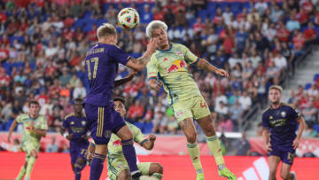 Jun 1, 2024; Harrison, New Jersey, USA; New York Red Bulls defender John Tolkin (47) and Orlando City midfielder Dagur Thorhallsson (17) battle for the ball during the first half at Red Bull Arena. Mandatory Credit: Vincent Carchietta-USA TODAY Sports