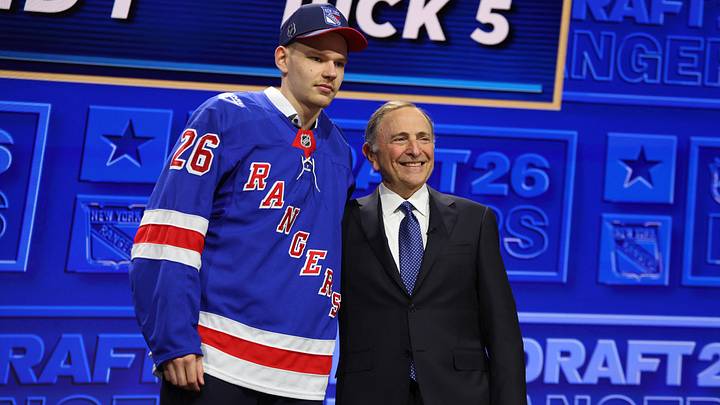 Jun 26, 2026; Buffalo, New York, USA; Alberts Smits reacts beside NHL commissioner Gary Bettman after being selected with the fifth pick in the first round of the 2026 NHL Draft by the New York Rangers at KeyBank Center. Mandatory Credit: Timothy T. Ludwig-Imagn Images