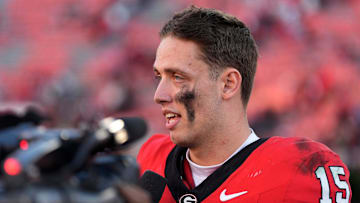 Georgia quarterback Carson Beck (15) speaks with the media after a NCAA college football game against Massachusetts in Athens, Ga., on Saturday, Nov. 23, 2024. Georgia won 59-21.