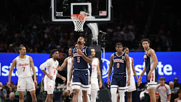 Mar 15, 2025; Kansas City, MO, USA; Arizona Wildcats guard KJ Lewis (5) reacts against the Houston Cougars during the first half for the Big 12 Conference Tournament Championship game at T-Mobile Center. Mandatory Credit: William Purnell-Imagn Images