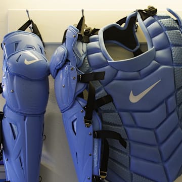 Apr 7, 2023; Milwaukee, Wisconsin, USA;  Catchers gear hangs in the Milwaukee Brewers dugout prior to the game against the St. Louis Cardinals at American Family Field. Mandatory Credit: Jeff Hanisch-Imagn Images