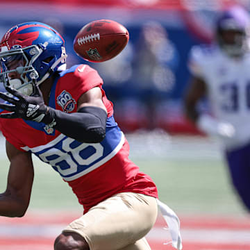 Sep 8, 2024; East Rutherford, New Jersey, USA; New York Giants wide receiver Darius Slayton (86) fumbles a punt during the first half against the Minnesota Vikings at MetLife Stadium. Mandatory Credit: Vincent Carchietta-Imagn Images