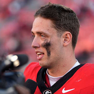 Georgia quarterback Carson Beck (15) speaks with the media after a NCAA college football game against Massachusetts in Athens, Ga., on Saturday, Nov. 23, 2024. Georgia won 59-21.