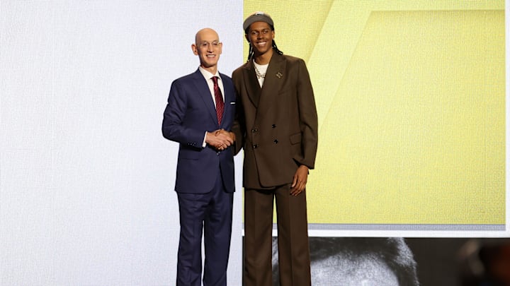 Jun 26, 2024; Brooklyn, NY, USA; Cody Williams poses for photos with NBA commissioner Adam Silver after being selected in the first round by the Utah Jazz in the 2024 NBA Draft at Barclays Center. Mandatory Credit: Brad Penner-Imagn Images