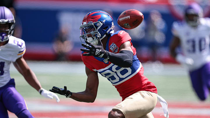 Sep 8, 2024; East Rutherford, New Jersey, USA; New York Giants wide receiver Darius Slayton (86) fumbles a punt during the first half against the Minnesota Vikings at MetLife Stadium. Mandatory Credit: Vincent Carchietta-Imagn Images