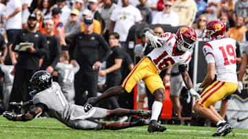 Sep 30, 2023; Boulder, Colorado, USA; USC Trojans wide receiver Tahj Washington (16) runs the ball