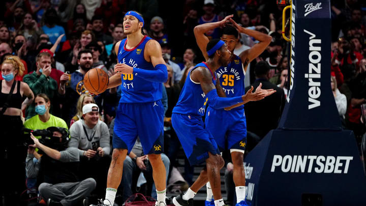 Nov 19, 2021; Denver, Colorado, USA; Denver Nuggets forward Aaron Gordon (50) and forward Will Barton (5) and guard P.J. Dozier (35) react to a foul called in the fourth quarter against the Chicago Bulls at Ball Arena. 