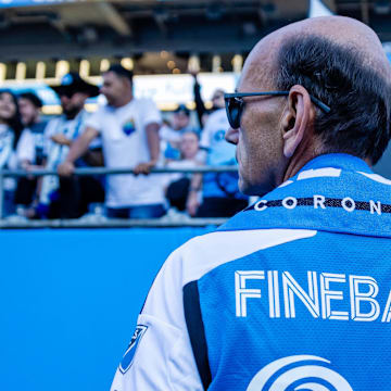 Paul Finebaum waits to get crowned at the Charlotte FC match 