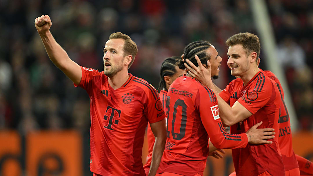 Bayern Munich players celebrating against Augsburg.