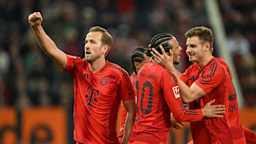 Bayern Munich players celebrating against Augsburg.