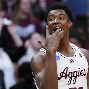 March 20, 2025; Denver, CO, USA; Texas A&M Aggies forward Pharrel Payne (21) reacts after the win over Yale Bulldogs at Ball Arena. Mandatory Credit: Ron Chenoy-Imagn Images