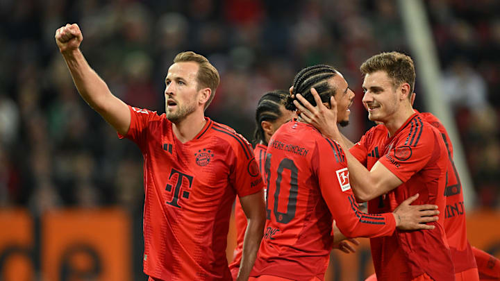 Bayern Munich players celebrating against Augsburg.