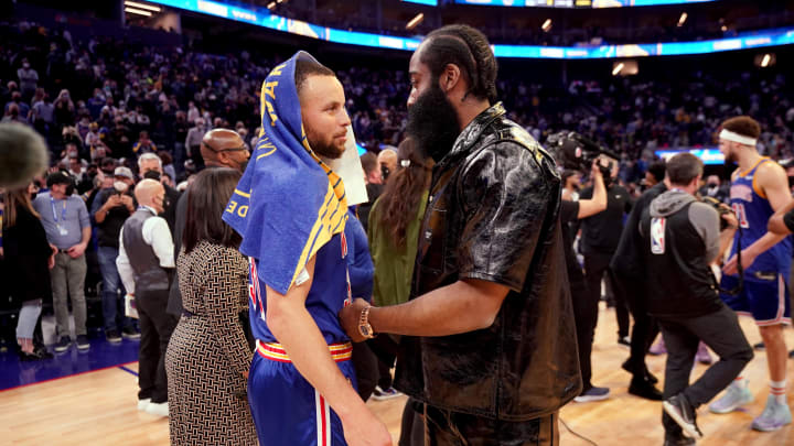 Jan 29, 2022; San Francisco, California, USA; Golden State Warriors guard Stephen Curry (left) meets with Brooklyn Nets guard James Harden after a game at the Chase Center. 