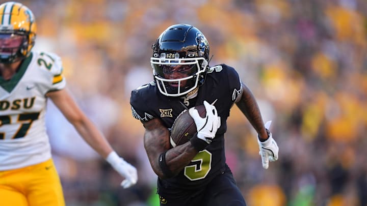 Aug 29, 2024; Boulder, Colorado, USA; Colorado Buffaloes wide receiver Jimmy Horn Jr. (5) runs after a reception in the first half against the North Dakota State Bison at Folsom Field. Mandatory Credit: Ron Chenoy-Imagn Images