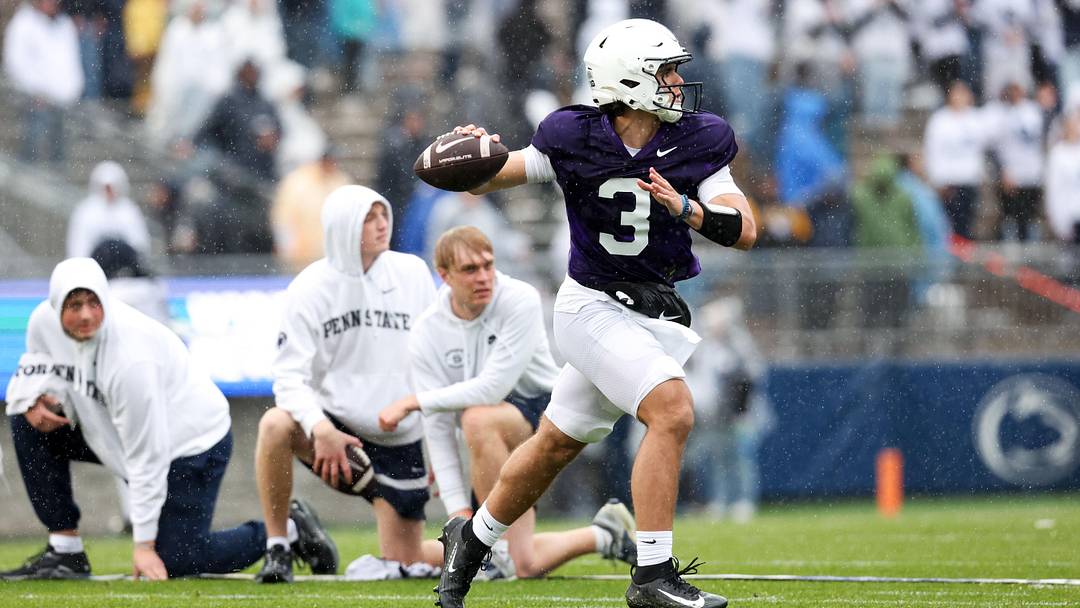 Penn State Nittany Lions quarterback Rocco Becht looks to throw a pass on the run during the Blue-White Spring game at Beaver Stadium. 