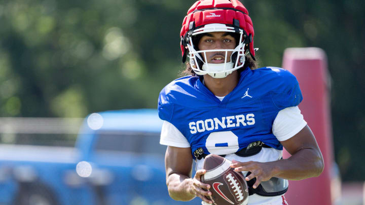 Michael Hawkins Jr. (9) runs drills during an Oklahoma football practice