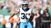 Oct 19, 2025; East Rutherford, New Jersey, USA; Carolina Panthers running back Chuba Hubbard (30) runs with the ball in the second quarter against the New York Jets at MetLife Stadium. Mandatory Credit: Vincent Carchietta-Imagn Images
