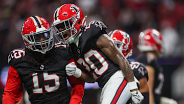 Sep 29, 2024; Atlanta, Georgia, USA; Atlanta Falcons linebacker Matthew Judon (15) and cornerback Dee Alford (20) celebrate after a turnover on downs against the New Orleans Saints in the fourth quarter at Mercedes-Benz Stadium. Mandatory Credit: Brett Davis-Imagn Images
