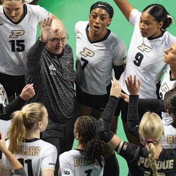 Purdue coach Dave Shondell, center, brings his team together before their match against Oregon 